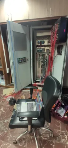 Open control cabinets showing the installed equipment and wiring.