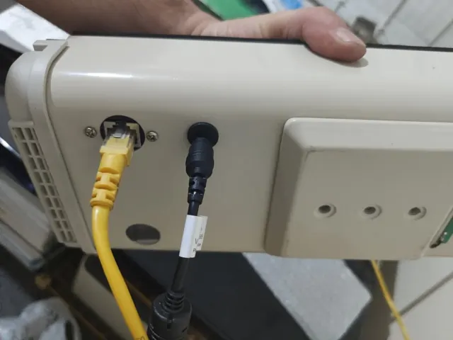 Network and power cables connected to the prototype enclosure.